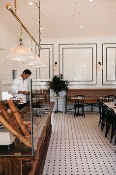 a man is preparing food in a restaurant