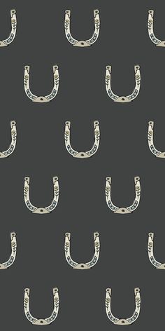 a black and white pattern with an image of a pair of horseshoes on it