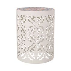 a white table with an intricate design on the top and bottom, in front of a white background