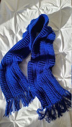 This beautiful, hand knit scarf in trendy royal blue will add a pop of color to your look and will bring you the ultimate comfort in any chill season. Perfect as a gift or as a well-earned treat for yourself. Material:  high quality 100% acrylic. Care:  machine wash warm, permanent press setting. Tumble dry low. Do not iron. Do not dry clean. Dimensions (inches):                                             Dimensions (centimeters): Length: 72.5 (without fringe)                               Leng Blue Scarf Knitted, Knitting For Men Gift, Blue Crochet Scarf, Crochet Things For Men, Crochet Scarf For Men, Man Scarf, Crochet Scarfs, Christmas Scarf, Spring Scarves