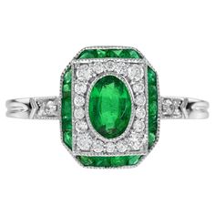 An impressive antique Art Deco inspired oval green emerald with diamond and French cut emerald accent. The ring is crafted in 18k white gold. Low set, comfortable and unique this ring is outstanding. Ring Information Style: Art-deco Metal: 18K White Gold Total weight: 3.31 g. (approx. total weight) Ring size: US3-8 available Center Gemstones Type: Emerald Shape: Oval Size: 6 x 4 mm. Number: 1 Weight: 0.45 Carat (approx. total weight) Accent Gemstones Type: Emerald Shape: French Cut Number: 18 We Green Princess, Diamond Ring Princess Cut, Platinum Diamond Rings, Emerald Diamond Ring, Ladies Diamond Rings, Estilo Art Deco, Platinum Ring, Fine Rings, Princess Cut Diamonds