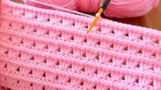 the crochet is being worked on with a needle