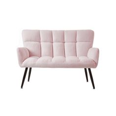 a pink couch sitting on top of a white floor next to a black legrest