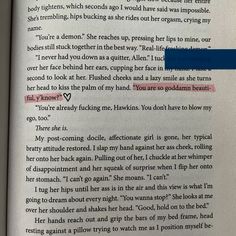 an open book with the page highlighted in red and blue text on top of it