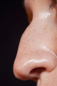 a close up of a person's nose and nose