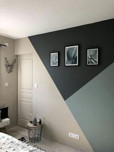 a bedroom with black and white decor on the walls