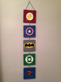 the wall is decorated with different types of superheros and their name on it,