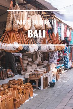 an outdoor market with lots of baskets on display