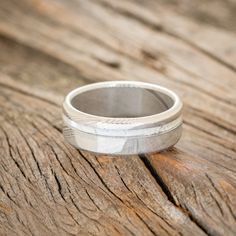 a wedding ring sitting on top of a wooden table