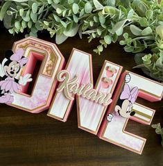 the word love spelled out with minnie mouse