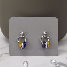 Dainty Pride Earrings in the colors of the Nonbinary Pride flag.💛 aluminum links on stainless steel ear post🖤 extra ear backs included (extras may be different style)💜 Earrings are mirror image since that is what most customers have requested. If you prefer each earring to be the same (yellow on the left for both), just leave a note during checkout and I'll be sure to make your earrings that way. NONBINARY PRIDE colorway: yellow, white, purple, black Acexual Earrings, Bigender Earrings, Omnisexual Earrings, Non Binary Earrings, Nonbinary Jewelry, Nonbinary Earrings, Enby Style, Pride Earrings, Flag Earrings