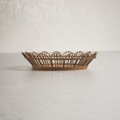 a wooden basket sitting on top of a table