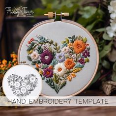 an embroidery heart with flowers on it and the words hand embroidery template next to it