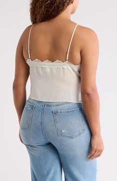 Showcase your sultry style in this flattering cropped camisole trimmed with lovely lace. 20" length (size 1X) V-neck Spaghetti straps 100% polyester Hand wash, line dry Imported Lace Crop Top Tank With Lace Trim, Lace Crop Top With Lace Trim, V-neck Lace Crop Top With Lace Trim, Lace Cami Crop Top With Lace Trim, Lace Trim Crop Top Tank Top, Lace Trim Lace Camisole Crop Top, Chic Lace Trim Crop Top Tank, Fitted Lace Trim Crop Top Camisole, Lace Crop Top Camisole