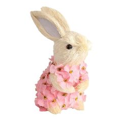 a stuffed rabbit with pink flowers on it's chest sitting in front of a white background