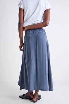 Combining practicality with flair, this Utility Skirt features functional pockets and a crisp fabric that effortlessly transitions from day to night with a touch of urban charm. Drapey fit Button closure Front pockets Hits above the ankle Daywear Skirted Bottoms With Pockets, Long Skirt With Pockets For Daywear, Relaxed Maxi Skirt With Pockets For Daywear, Versatile Flowy Skirt With Pockets, Relaxed Skirted Bottoms With Side Pockets, Versatile Daywear Relaxed Skirt, Versatile Relaxed Skirt With Pockets, Relaxed Cargo Skirt With Lining, Relaxed Skirted Bottoms With Pockets