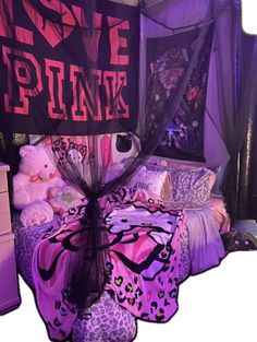 a bed with purple and black decorations on it