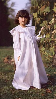 Childhood Dreams Pattern. Girls sizes 2-12. For a special little girl, here's a scaled-down version of Beautiful Dreamer, the Victorian lady's favorite nightgown. An ideal children's style for daytime and special occasions, too. Suggested fabrics: Light to medium-weight cotton, linen, rayon, silk, or blends such as lawn, dotted Swiss, gauze, voile, muslin, challis, broadcloth, or flannel. Pioneer Fashion, Reference Clothes, Pioneer Clothing, Victorian Sewing, Victorian Nightgown, Nightgown Pattern, Blithe Spirit, Vintage Childrens Clothing