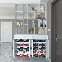 there are many pairs of shoes on the shelves in this room and one is open