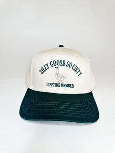 Two-toned green and natural snapback hat CALLING ALL SILLY GEESE! This hat is for the Silliest of Geese ONLY ! This is your official lifetime membership card into the Silly Goose Society! WELCOME - it's the best society to be in! Silly Goose, Hat Patches, Event Gifts, Embroidered Hat, Membership Card, Embroidered Hats, Cool Hats, Snapback Hat, Snapback Hats