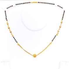 This Mangal Sutra, crafted in 22k yellow gold and weighing 8.9 grams, features an intricate design with dangling orbs and black bead embellishments. The necklace length is 17 inches, ideal for a graceful and elegant appearance. Secured with an 'S' lock, this piece beautifully combines traditional cultural elements with a unique, modern twist, making it perfect for those who value both heritage and contemporary design in their jewelry. PRODUCT DETAILS Gold Purity(karat): 22k Item Weight(grams): 8 Festive Black Necklace With Gold Beads, Elegant Black Temple Necklace As Gift, Elegant Black Temple Necklace Gift, Gold Necklaces With Black Beads For Celebration, Festive Gold Necklace With Black Beads, Festive Gold Necklaces With Black Beads, Elegant Black Temple Necklace For Festive Occasion, Elegant Black Temple Necklace For Wedding, Festive Black Round Necklace