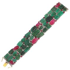 A stunning statement cuff handmade in 14K gold. It is hand set in carved motifs throughout, 129.82 carats emerald, 31.08 carats ruby & 5.36 carats of sparkling diamonds. Clasp Closure FOLLOW MEGHNA JEWELS storefront to view the latest collection & exclusive pieces. Meghna Jewels is proudly rated as a Top Seller on 1stDibs with 5 star customer reviews. All items manufactured by us are handmade and can be customized or redesigned. Composition Gold Weight(Gms)-4.69 Silver Weight-42.54 Diamond Wt(Ct Diamond Cuff Bracelet, Gold Bracelet Cuff, Ruby Diamond, Pearl Diamond, Vintage Jewels, Emerald Diamond, Sparkle Diamonds, Beautiful Bracelet, Cuff Bracelet