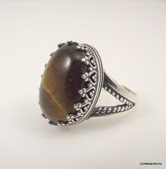 Large Victorian Sterling Silver Tiger's Eye Ring by JSWMetalWorks Brown Oval Gemstone Rings, Brown Oval Cabochon Rings, Sterling Silver Brown Rings With Polished Finish, Sterling Silver Rings With Brown Polished Finish, Brown Sterling Silver Rings With Polished Finish, Brown Sterling Silver Cabochon Ring, Brown Sterling Silver Ring With Cabochon, Unique Brown Oval Rings, Handmade Oval Brown Rings