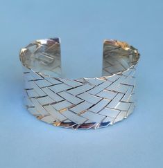 "Wide Woven Sterling Silver Cuff - 7\" inside circumference This is a handcrafted cuff bracelet that is tightly woven with sterling strips, and each strip is 3/16\" wide. The cuff is concave, and the ends have sterling strips soldered on for wearing comfort. Wide and bold, it has a nice hefty weight of 41.96 grams. In excellent vintage condition....well-formed with no dings or dents. Bright and polished with no tarnishing....highly reflective so kindly disregard any visual feedback and reflectio Sterling Silver Cuff Bracelet, Sterling Silver Cuff, Silver Cuff Bracelet, Artisan Craft, Silver Cuff, Cuff Bracelet, Cuff Bracelets, Springs, Silver Bracelet