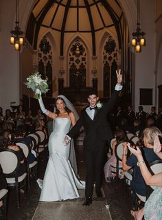 the bride and groom are walking down the aisle