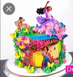 there is a cake decorated with an image of a woman on top of the cake