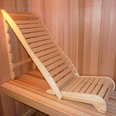 a wooden chair sitting inside of a sauna