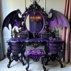 an ornate purple vanity with dragon wings on it