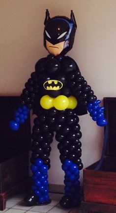 a balloon batman standing in the middle of a room