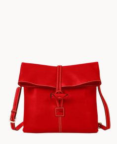 Something Unique    This supple crossbody, made from Italian Vacchetta leather that grows softer with age, catches the eye with its unique toggle closure that secures the bag.