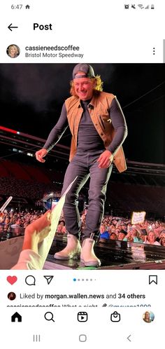 a man is standing on top of a stage