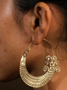 "Add a touch of unique ethnic style with our brass Hmong earrings. These hoops are perfect for anyone looking to add a playful twist to their wardrobe. (Excuse the pun, but these earrings are H'mong-stly the best!)" Traditional Festival Plug Earrings Nickel Free, Brass Hoop Earrings With Latkans For Festivals, Traditional Small Hoop Earrings For Festival, Ornate Earrings For Rituals, Traditional Metal Hoop Earrings For Festivals, Traditional Bronze Pierced Hoop Earrings, Traditional Metal Hoop Earrings (pierced), Festive Brass Plug Earrings, Traditional Metal Hoop Earrings