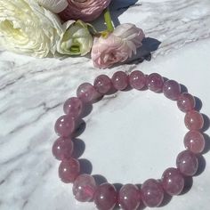 "High Quality, Pink Emerald with Mica beaded bracelet, 8mm, 8.5mm, 9.5mm, 10mm or 10.5mm width. Standard 7 inch size but can be customized slightly smaller or larger. Emerald is known as the \"stone of successful love\".  It brings loyalty and provides for domestic bliss.  It enhances unconditional love, unity and promotes friendship.  Keeps partnerships in balance.  Emerald stimulates the heart chakra, having a healing effect on the emotions as well as the physical heart.  It ensures physical, Gift Rosary Bracelet With 8mm Round Beads, Gift Rosary Bracelet With 8mm Beads, Stretch Bracelet With 8mm Beads, Domestic Bliss, Pink Emerald, Emerald Bracelet, Selenite Crystal, Quartz Bracelet, Unconditional Love