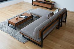 a living room filled with furniture on top of a hard wood floor