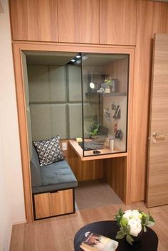 a room with a couch, desk and mirror in it's centerpieces