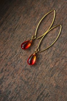 Lovely feminine earrings with red-yellow glass drop beads, gold tone stainless steel jumping rings, gold tone V shape stainless steel earring hooks. Earring hooks are from nickel free and lead free metal. *The total lenght of earrings is about 55 mm including earring hooks. Perfect jewelry for everyday wear! Other earrings of my shop you can see here: https://www.etsy.com/shop/NaTavelli?section_id=13757927 Thank you for visit! Red Handmade Drop Earrings, Red Long Drop Earrings With Ear Wire, Unique Handmade Red Earrings, Red Pierced Drop Earrings, Gold And Red Earrings Dangle, Cowrie Shell Jewelry, Feminine Earrings, Glass Drop Earrings, Fancy Jewellery