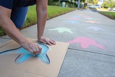 Make a sidewalk path to the Book Fair by drawing simple dinosaur footprints with colored chalk. Toolkit keyword: FOOTPRINT Tropisk Fest, Dinosaur Birthday Party Decorations, Park Birthday, Dinosaur Themed Birthday Party, Colored Chalk, Dino Birthday Party, Third Birthday Party