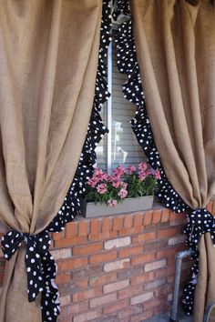 the window is decorated with black and white polka dots