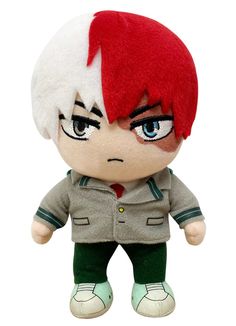 a small stuffed animal with red hair and green pants