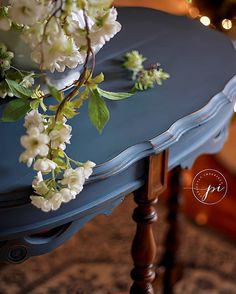 a blue table with white flowers on it