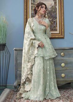 Include: shirt Fabric: shirt: Embossed Swiss Silk Color: Pistachio Description: Roshni celebrates tradition and culture with a fusion of modernity in the most alluring shade of pistachio green designed on a luxurious embossed silk, with delicate and intricate crystal embroidery. Coordinate and complete this look by adding this silk embossed sharara with a graceful flair (sold separately) and this silk embossed floral dupatta with kiran finishings (sold separately).Disclaimer: The color of the ou Lengha Modern Pakistani, Sharara Frock Design, Desi Dress Design, New Sharara Design, Frock Sharara Suit, Frock And Sharara, Frock Sharara, Floral Dupatta, Mehndi Dresses