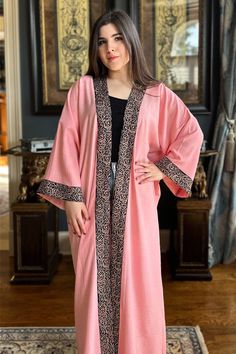 Featuring: Open Abaya Kimono. Golden Arabic Calligraphy embroidery lining on opening and sleeves hem. Maxi Length. Color: Pink.Fabric: Linen.Brand: Unmatched BYU Length: 55 inches. Long Abaya With Embroidered Border For Eid, Traditional Long Sleeve Pink Abaya, Traditional Pink Long Sleeve Abaya, Long Sleeve Dabka Kimono For Eid, Arabic Calligraphy Embroidery, Golden Arabic Calligraphy, Calligraphy Embroidery, Pink Abaya, Abaya Kimono