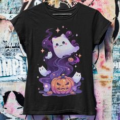 Celebrate Halloween with our adorable Pastel Gothic Ghost Cat T-shirt, showcasing a whimsical ghost cat nestled inside a pumpkin. This charming design blends the mystic allure of pastel goth with a playful Halloween theme, perfect for those who love their spooky season with a dash of cute. Designed to be unisex and available in oversized and plus sizes, this tee is ideal for anyone into Japanese streetwear, or as a quirky gift for fans of anime, pastel goth, and grunge styles. Embrace the spirit Short Sleeve T-shirt With Cat Print For Halloween, Kawaii Halloween Short Sleeve T-shirt, Kawaii Short Sleeve Halloween T-shirt, Spooky Halloween T-shirt With Cat Design, Kawaii Halloween Graphic Print Tops, Spooky Cat Design T-shirt For Fall, Pastel Goth Anime, Anime Pastel, Unique Crop Tops