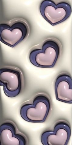 many hearts are arranged in the shape of heart shapes on a white and blue background