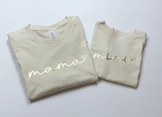 Matching mama and mini shirts. All shirts are made with a quality Bella + Canvas unisex style shirt.  Although this is advertised as a set you can certainly order just a mama shirt or just a mini depending on your needs.   SHIPPING: All orders will be shipped using USPS ground shipping (2-5 business days) unless you have upgraded. I always aim to get your items out as quickly as possible but if you need something to arrive by a certain time please message me and I'll do my best. SOCIAL MEDIA:   Follow me on Instagram to be the among the first to see new items and snag discounts @thechelleshoppe.  I absolutely love seeing how you style your shirts so please feel free to tag me! **CARE INSTRUCTIONS** To ensure the shirt and its design maintain a quality appearance please be sure to wash insi Mom And Baby Matching Outfits, Baby Matching Outfits, Mini Shirts, Mother Daughter Shirts, Mom And Me, Daughters Shirt, New Mom Gift, Mama Shirts, Mommy And Me Outfits