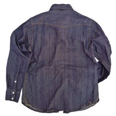 *This item is eligible for exchange or store credit only, no refunds. SPECS * Fabric: 100% cotton herringbone twill denim, subtle vertical stripe design, dark indigo color, about 8 Oz. Origin USA.* Slim ‘western shirt’ type silhouette and fit.* Painted metal DOT snaps. The white paint will chip with age.* Vintage ‘Roebuck’ type front yoke.* Western style back yoke.* Two chest pockets, snap flaps, locked into yoke construction.* Double snap cuffs.* Orange and yellow 100% cotton stitching combinat Tailored Sportsman, Rangers Shirt, Cowboy Jacket, Raw Fabric, Indigo Color, Indigo Colour, Vintage Inspired Outfits, Appaloosa, Blue Jean Shorts